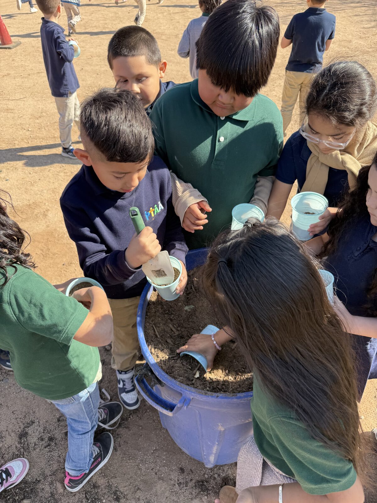 PTAA Arizona students planting a school garden together