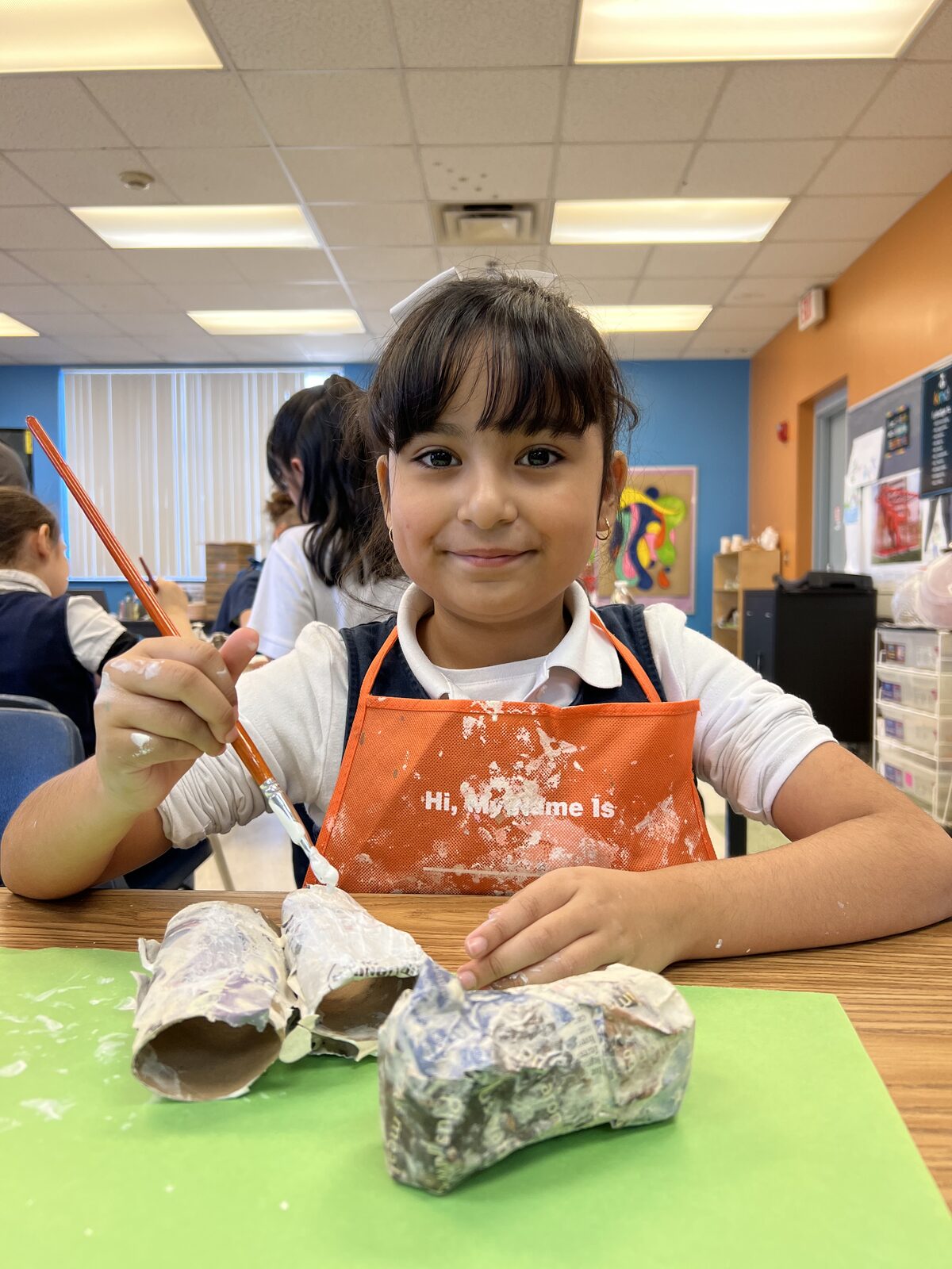 A PTAA Arizona student working with clay in art class