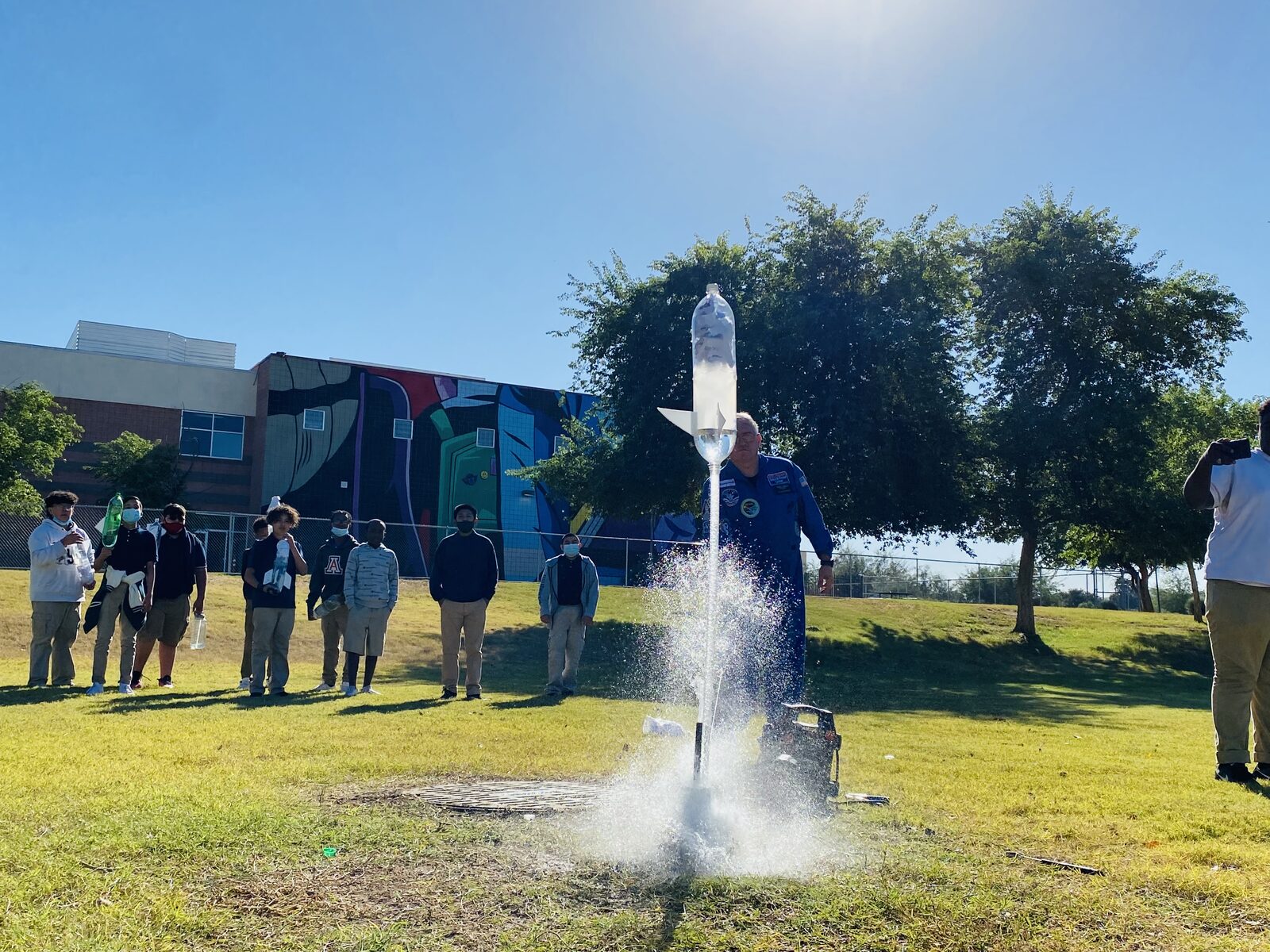 PTAA Arizona students launching a model rocket outdoors